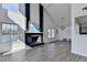 Open concept living room boasting a fireplace, vaulted ceiling, and lots of natural light at 2762 Inverloch Cir, Duluth, GA 30096