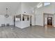 Inviting living room featuring lots of natural light, high ceilings, and views into the kitchen at 2762 Inverloch Cir, Duluth, GA 30096