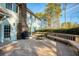 View of outdoor deck with table, grill, and built-in seating off the back of this home at 5443 Dunwoody Knoll Ct, Dunwoody, GA 30338