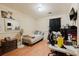 This is a well-lit bedroom with light wood floors, simple decor, and functional furniture at 5461 Chuzzlewit Sw Ct, Lilburn, GA 30047