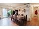 Cozy dining room area is bathed in natural light from the adjacent doorway at 5461 Chuzzlewit Sw Ct, Lilburn, GA 30047