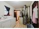 Utility room features washer, dryer and mechanical systems at 5461 Chuzzlewit Sw Ct, Lilburn, GA 30047