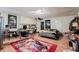 Spacious living room area features hardwood style floors and recessed lighting at 5461 Chuzzlewit Sw Ct, Lilburn, GA 30047