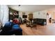 Spacious living room showcasing wood floors, stone fireplace, and a comfortable seating arrangement at 5461 Chuzzlewit Sw Ct, Lilburn, GA 30047