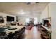 Spacious living room area features hardwood style floors and recessed lighting at 5461 Chuzzlewit Sw Ct, Lilburn, GA 30047