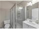 Bright bathroom featuring a glass-enclosed shower and a vanity with modern fixtures at 3000 Shade Tree Ct, Villa Rica, GA 30180