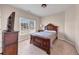 The bedroom features natural light, dark furniture, and neutral carpet, creating a comfortable and inviting atmosphere at 3000 Shade Tree Ct, Villa Rica, GA 30180
