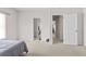 Neutral bedroom with carpet flooring and doors leading to other parts of the home at 3000 Shade Tree Ct, Villa Rica, GA 30180