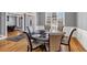 Dining room with hardwood floors, decorative molding, and an elegant round table with seating for six at 3000 Shade Tree Ct, Villa Rica, GA 30180