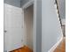 Hallway featuring hardwood floors, staircase, and doorway at 3000 Shade Tree Ct, Villa Rica, GA 30180