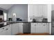 Lovely kitchen features white cabinetry, stainless steel appliances, and granite countertops at 3000 Shade Tree Ct, Villa Rica, GA 30180