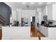 Bright kitchen features stainless steel refrigerator, oven, and sleek white cabinetry at 3000 Shade Tree Ct, Villa Rica, GA 30180
