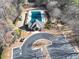 An aerial view of the community pool with a pool house and parking at 3000 Shade Tree Ct, Villa Rica, GA 30180