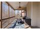 Screened porch features a ceiling fan, wood flooring, and furniture seating at 3000 Shade Tree Ct, Douglasville, GA 30180