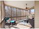 Relaxing screened-in porch with comfortable seating and ceiling fan for outdoor enjoyment at 3000 Shade Tree Ct, Villa Rica, GA 30180