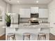 Bright kitchen featuring a large island with seating, stainless steel appliances, and granite countertops at 107 Hill Side Ln, Dallas, GA 30157