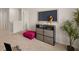 Upstairs sitting area with a tv and pink ottoman at 107 Hill Side Ln, Dallas, GA 30157