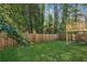 Manicured backyard with new wood fence and elevated wood deck at 2740 Dale Creek Nw Dr, Atlanta, GA 30318