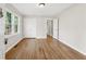 Bedroom with hardwood floors, natural light, and closet space for storage, with a neutral color palette at 2740 Dale Creek Nw Dr, Atlanta, GA 30318