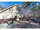 Spacious back deck features ample seating and woodland views at 8245 Mill Run Trl, Whitesburg, GA 30185