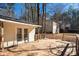 Backyard deck with a view of the house and surrounding foliage at 8245 Mill Run Trl, Whitesburg, GA 30185