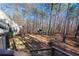 Spacious backyard with mature trees, as seen from the home's back deck at 8245 Mill Run Trl, Whitesburg, GA 30185