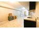 Basement kitchenette with sink, counter space and small refrigerator at 8245 Mill Run Trl, Whitesburg, GA 30185