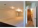 A large unfurnished carpeted basement with plenty of open space and natural light at 8245 Mill Run Trl, Whitesburg, GA 30185
