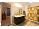 A tiled bathroom with a sink and a shower at 8245 Mill Run Trl, Whitesburg, GA 30185