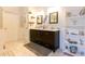 Charming bathroom featuring a double vanity, modern mirrors, and an abundance of natural light at 8245 Mill Run Trl, Whitesburg, GA 30185