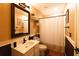 Charming bathroom features a vanity, decorative mirror, and shower with a curtain at 8245 Mill Run Trl, Whitesburg, GA 30185