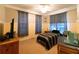 Bedroom with a ceiling fan, two windows and a bed at 8245 Mill Run Trl, Whitesburg, GA 30185