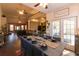 Spacious dining room with views into the living room, kitchen, and access to an outdoor patio at 8245 Mill Run Trl, Whitesburg, GA 30185
