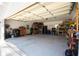 Spacious garage with shelving, storage, and ample room for multiple vehicles and projects at 8245 Mill Run Trl, Whitesburg, GA 30185