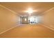Large living room features neutral carpeting with bonus area for a home gym at 8245 Mill Run Trl, Whitesburg, GA 30185