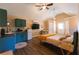 Cozy studio apartment showcasing a kitchenette, bed, and vaulted ceiling with a ceiling fan at 8245 Mill Run Trl, Whitesburg, GA 30185