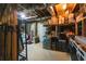 Unfinished basement with exposed ceiling, shelving, and stored items at 8245 Mill Run Trl, Whitesburg, GA 30185