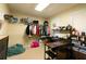 A well-organized walk-in closet with shelves and rods for ample storage at 8245 Mill Run Trl, Whitesburg, GA 30185