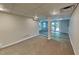 Finished basement area with recessed lighting, carpet, and a door to the back yard at 225 Powder Creek Dr, Dallas, GA 30157