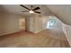 Spacious carpeted bedroom featuring neutral walls, ceiling fan, and a bright window at 225 Powder Creek Dr, Dallas, GA 30157