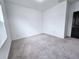 Carpeted bedroom with ample natural light and clean, neutral finishes at 3255 Bartee Walk, Suwanee, GA 30024