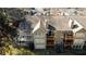Aerial view of condos with decks overlooking a grassy lawn at 709 Berkeley Woods Dr # 709, Duluth, GA 30096