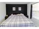 Bedroom with bed, black headboard, bedside tables, and a window with blinds at 709 Berkeley Woods Dr # 709, Duluth, GA 30096