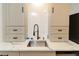 Updated kitchen featuring granite countertops, subway tile backsplash, and modern fixtures at 709 Berkeley Woods Dr # 709, Duluth, GA 30096