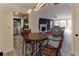 Open-concept living area with a view of the fireplace, modern lighting, and breakfast nook at 709 Berkeley Woods Dr # 709, Duluth, GA 30096