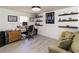 Functional office space with hardwood floors, built-in shelving, and comfortable seating at 709 Berkeley Woods Dr # 709, Duluth, GA 30096