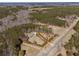 Aerial view of a beautiful home surrounded by a forest and well-maintained grounds at 212 Lakeview Dr, Newborn, GA 30056