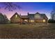 A stone house with a beautiful backyard and pergola on a sunny day at 212 Lakeview Dr, Newborn, GA 30056