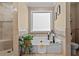 Bright bathroom featuring a soaking tub, decorative tile work, and a separate shower stall at 212 Lakeview Dr, Newborn, GA 30056