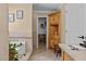 Well-lit bathroom with soaking tub, built-in storage, and access to walk-in closet at 212 Lakeview Dr, Newborn, GA 30056